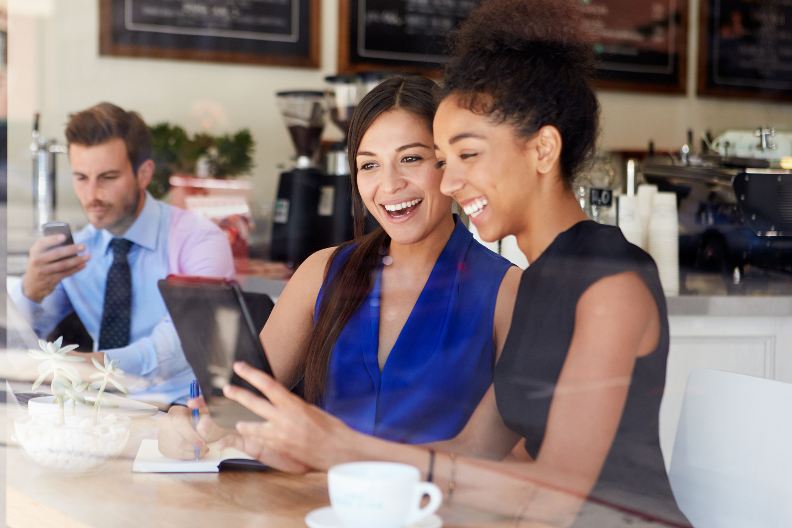 Two,Businesswomen,Meeting,In,Coffee,Shop Digital Natives